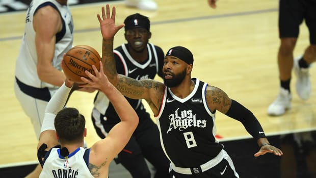 Jun 2, 2021; Los Angeles, California, USA; Los Angeles Clippers forward Marcus Morris Sr. (8) defends Dallas Mavericks guard Luka Doncic (77) as he looks to pass the ball in the first half of game five in the first round of the 2021 NBA Playoffs. at Staples Center. Mandatory Credit: Jayne Kamin-Oncea-USA TODAY Sports